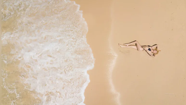 SandraDream being spied by a drone on the beach