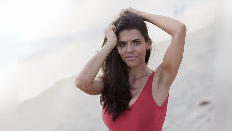 Wearing red swimsuit at the beach